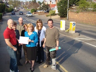 Eleanor Laing MP receives a petition concerning the state of the road in Loughton Way from local resident Dominic Harris